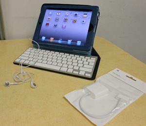 iPad 2, a wireless keyboard, headphones, a VGA (Visual Graphic Array) adapter.