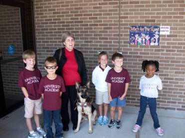 Gail Christian, her service dog Halo and University Academy Elementary students