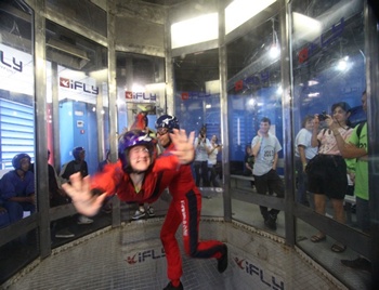 Students floating in wind tunnel