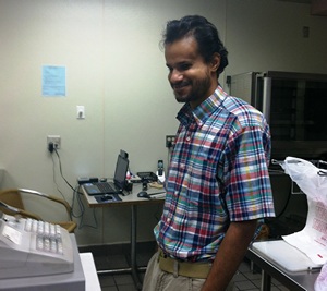 Jamal Delifus at cash register