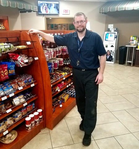 BBE vendor Jason Carpenter standing in front of a snack bar at the FDOE Turlington Building.