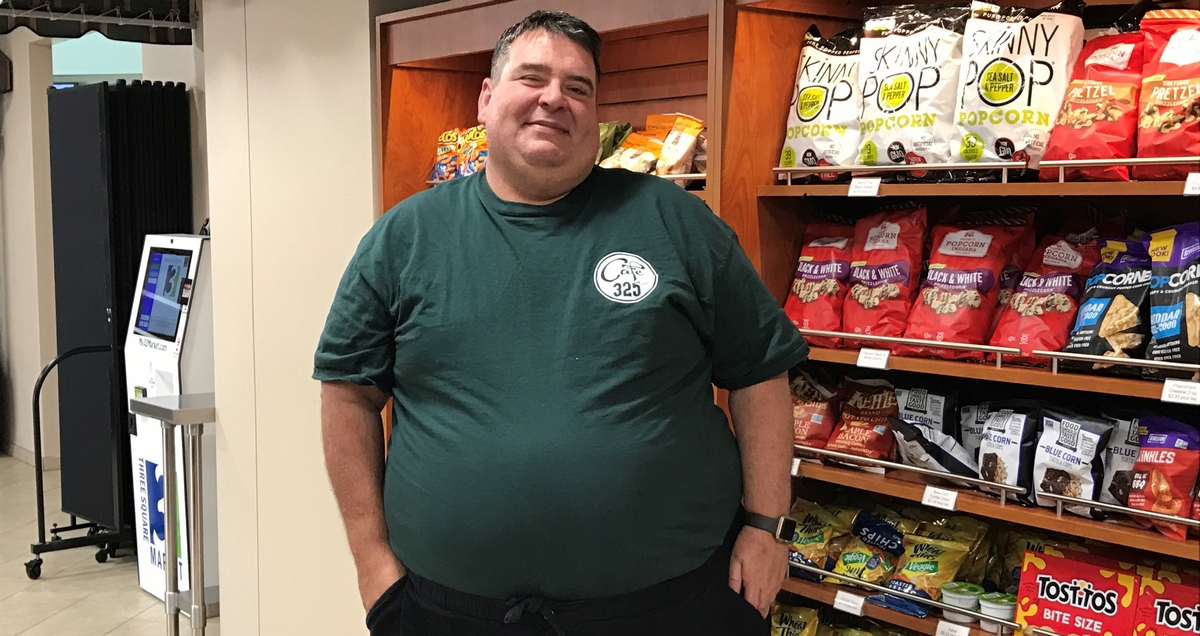BBE vendor Mike Renaud standing in front of a snack bar at the FDOE Turlington Building.