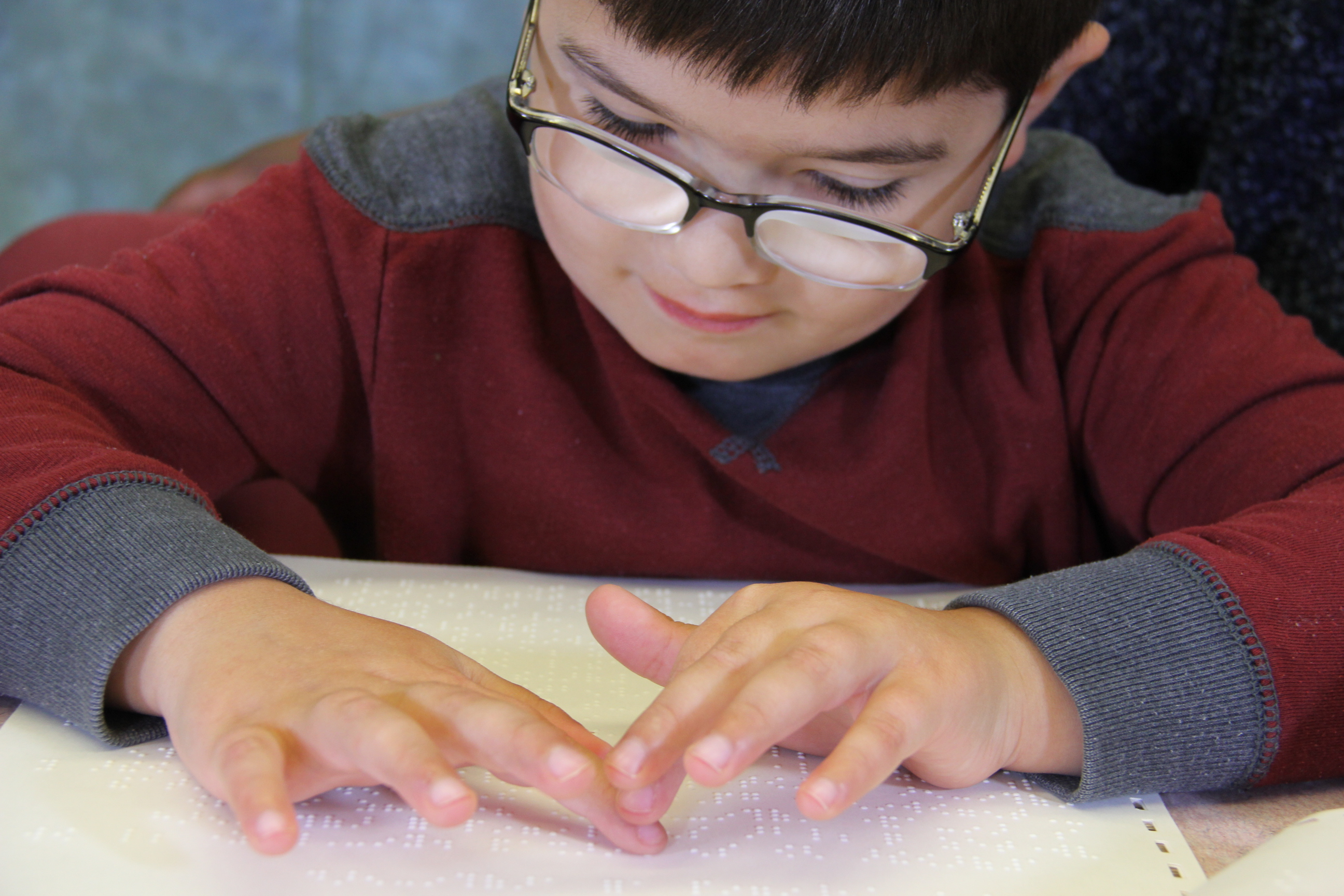 picture of child reading Braille