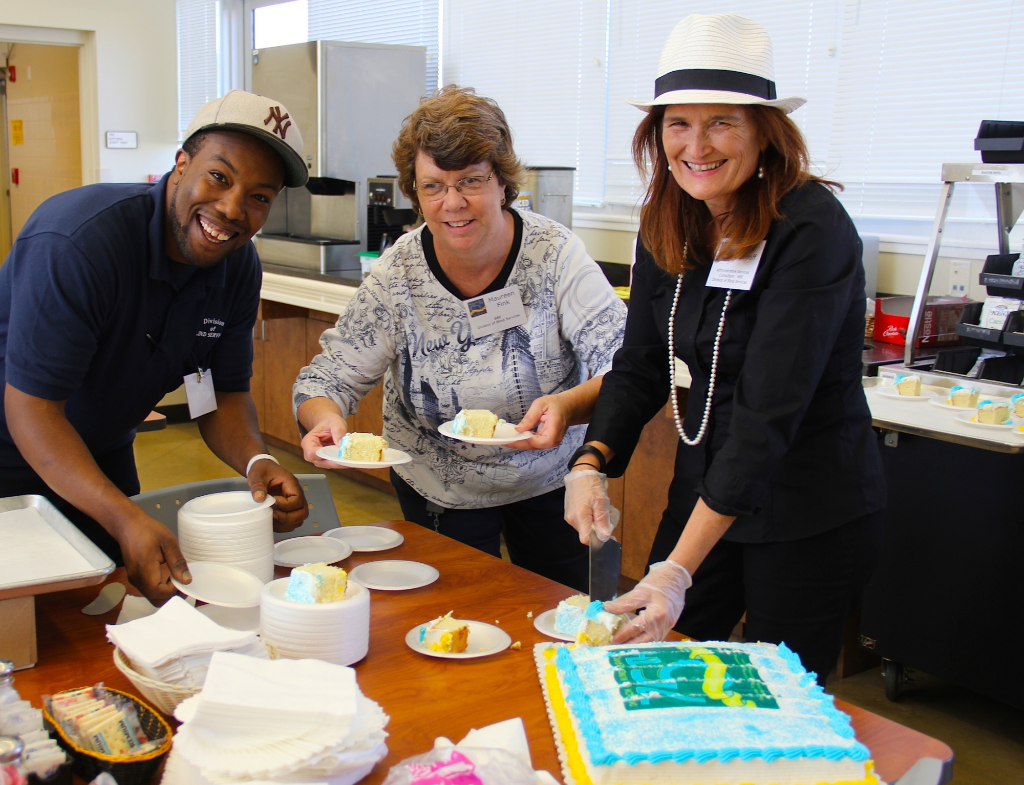 BBE staff cut the 75th anniversary cake 