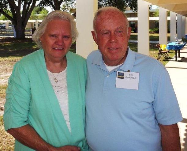 Jim Parkman standing with his wife