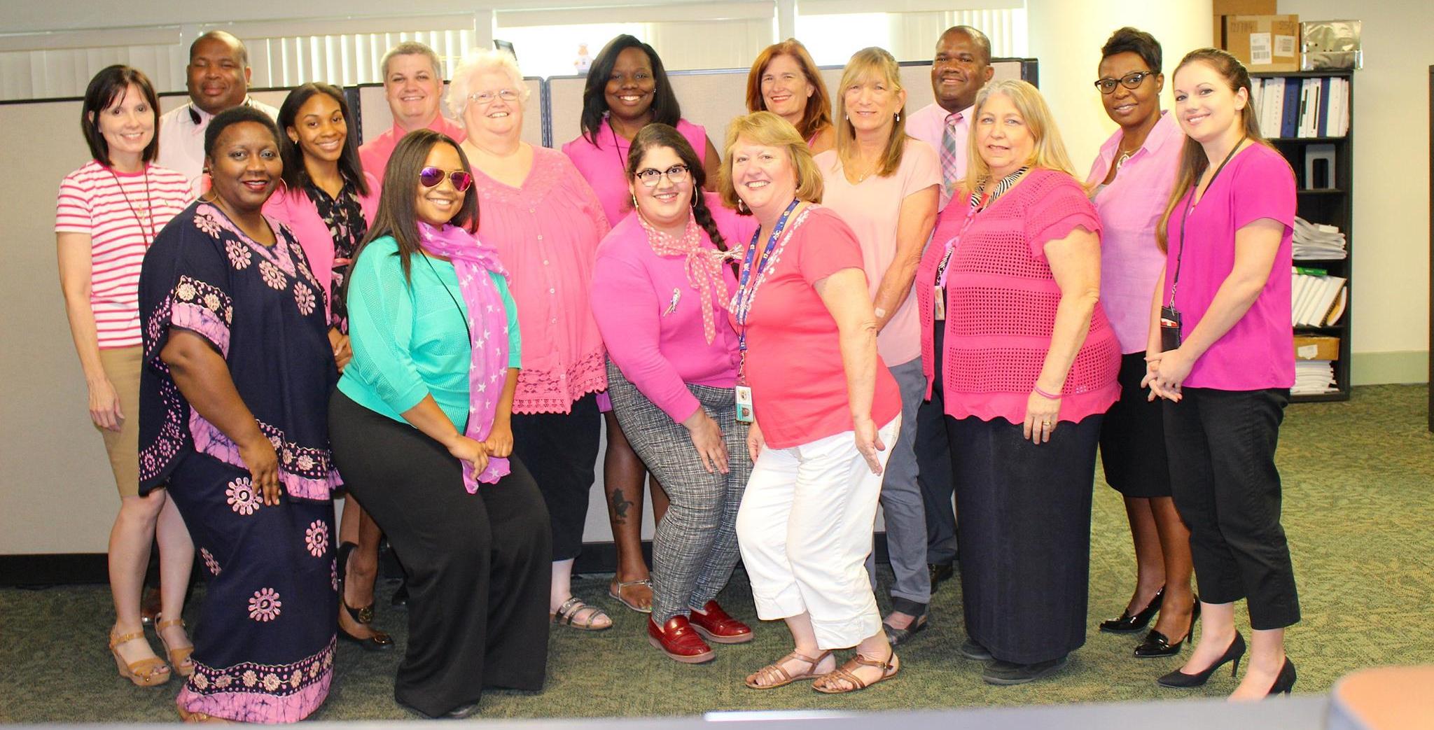 DBS employees wearing pink in support of breast cancer awareness month