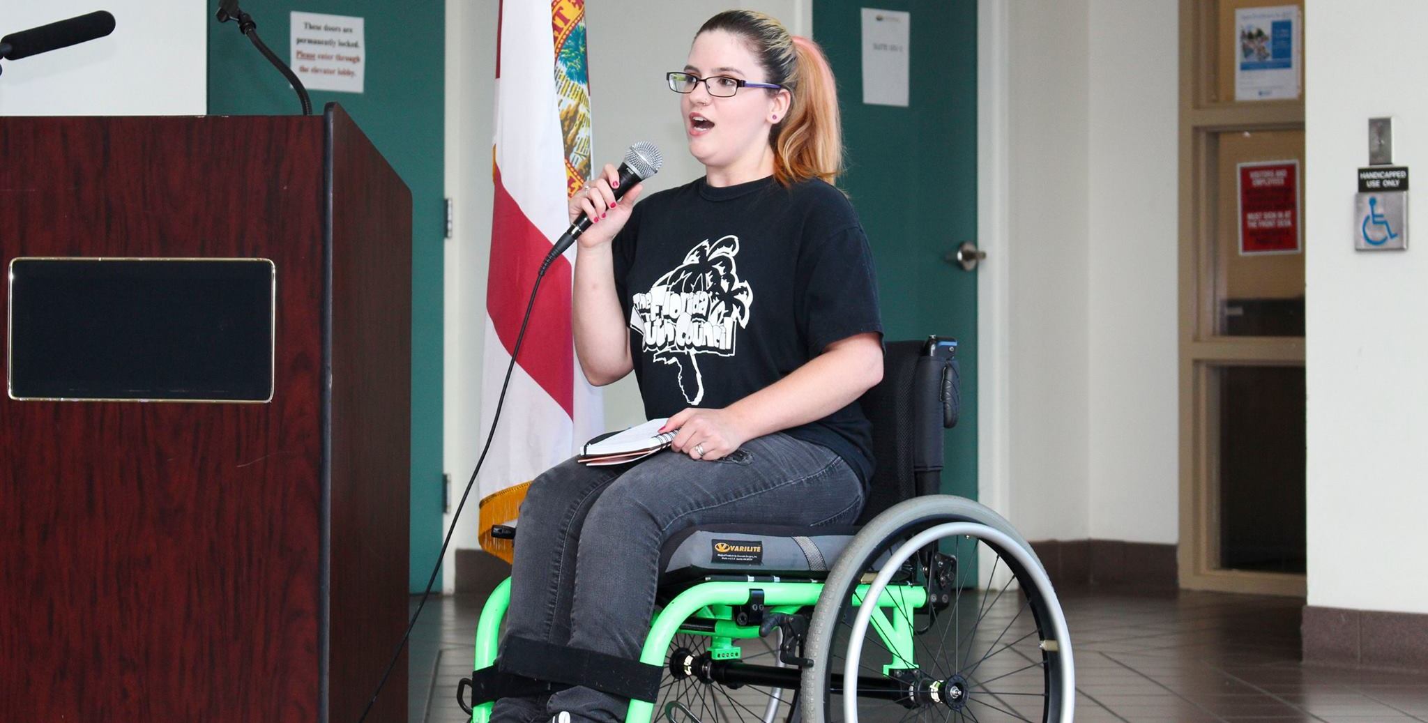 Girl in wheelchair making a speech
