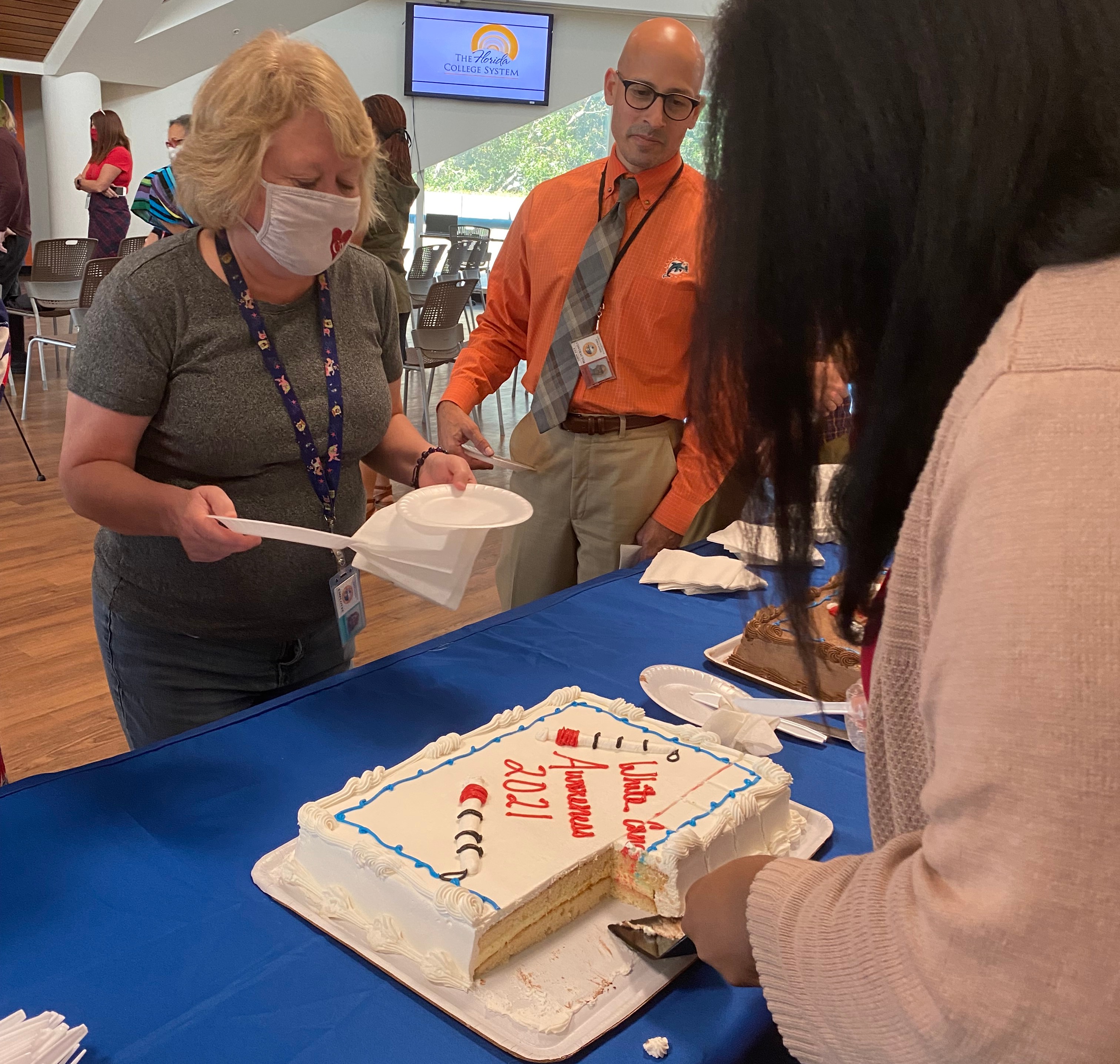 Guests are served cake decorated for white cane day