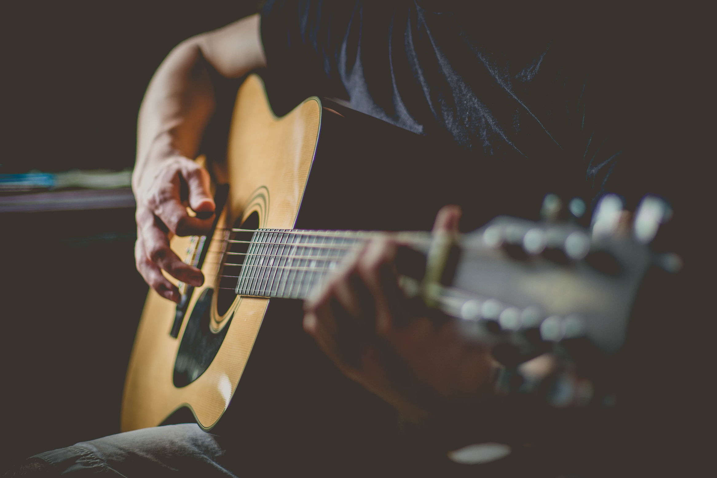 picture of someone playing a guitar.