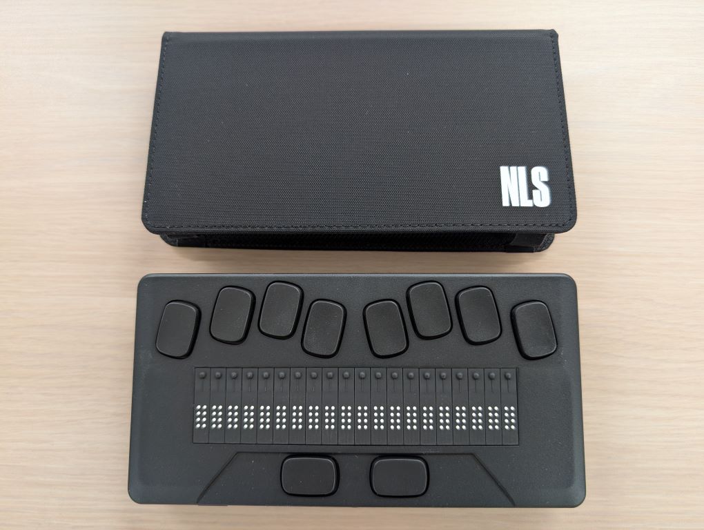 Close up view of Humanware  braille eReader and accessories.